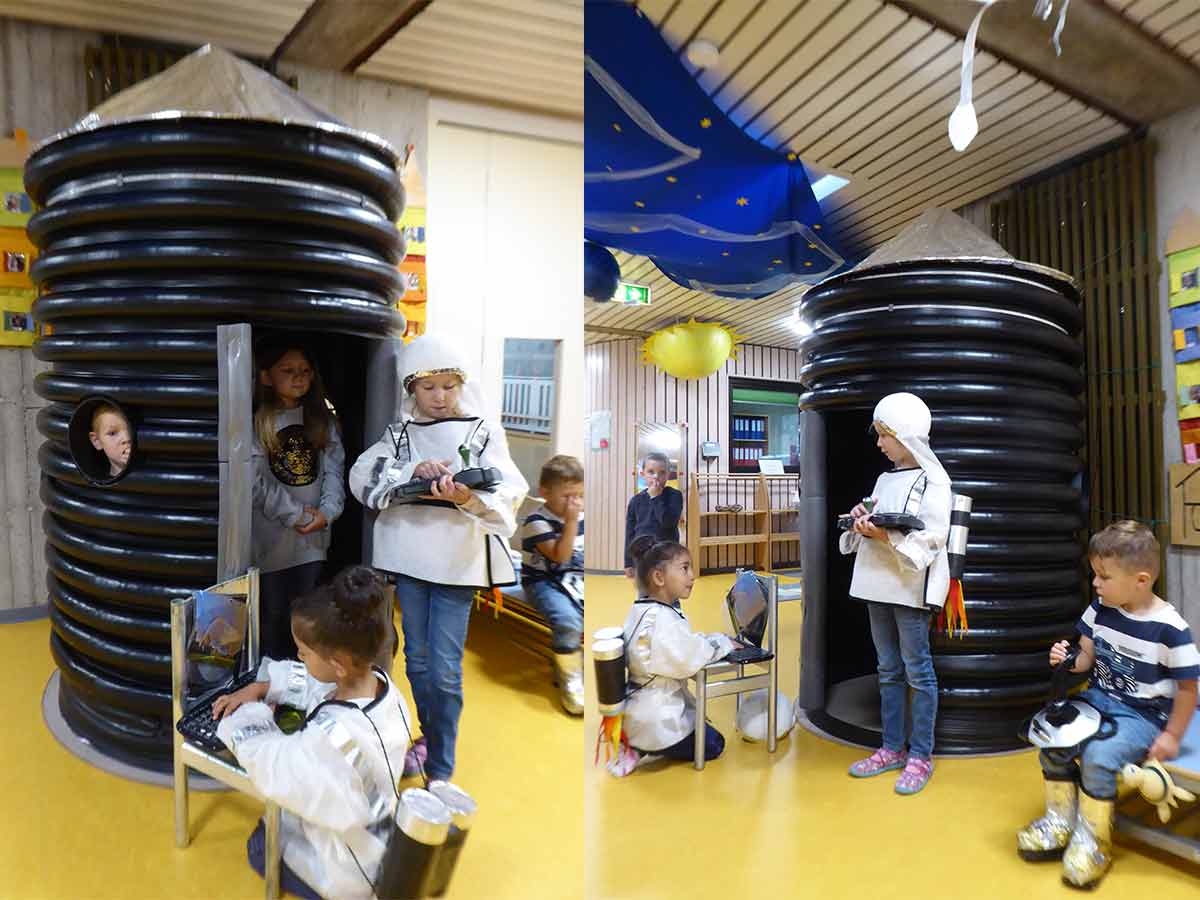 Mit viel Freude bespielen die Kinder die selbstgebaute Rakete. (Foto: Kita St. Elisabeth)